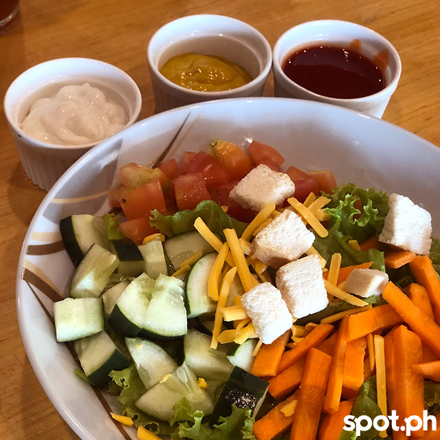 Garden salad with dipping sauces at Big Mike's